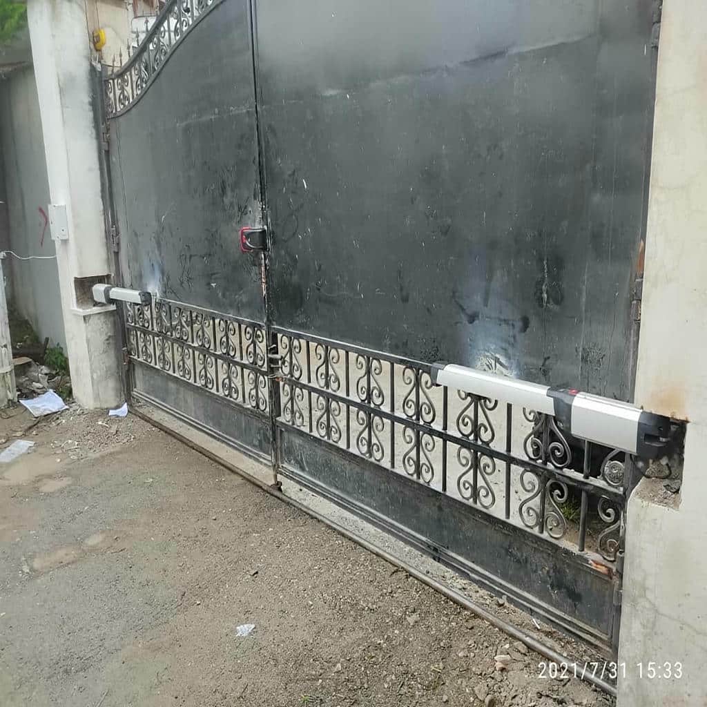 ساخت درب برقی پارکینگ ریلی با قاب فلزی
