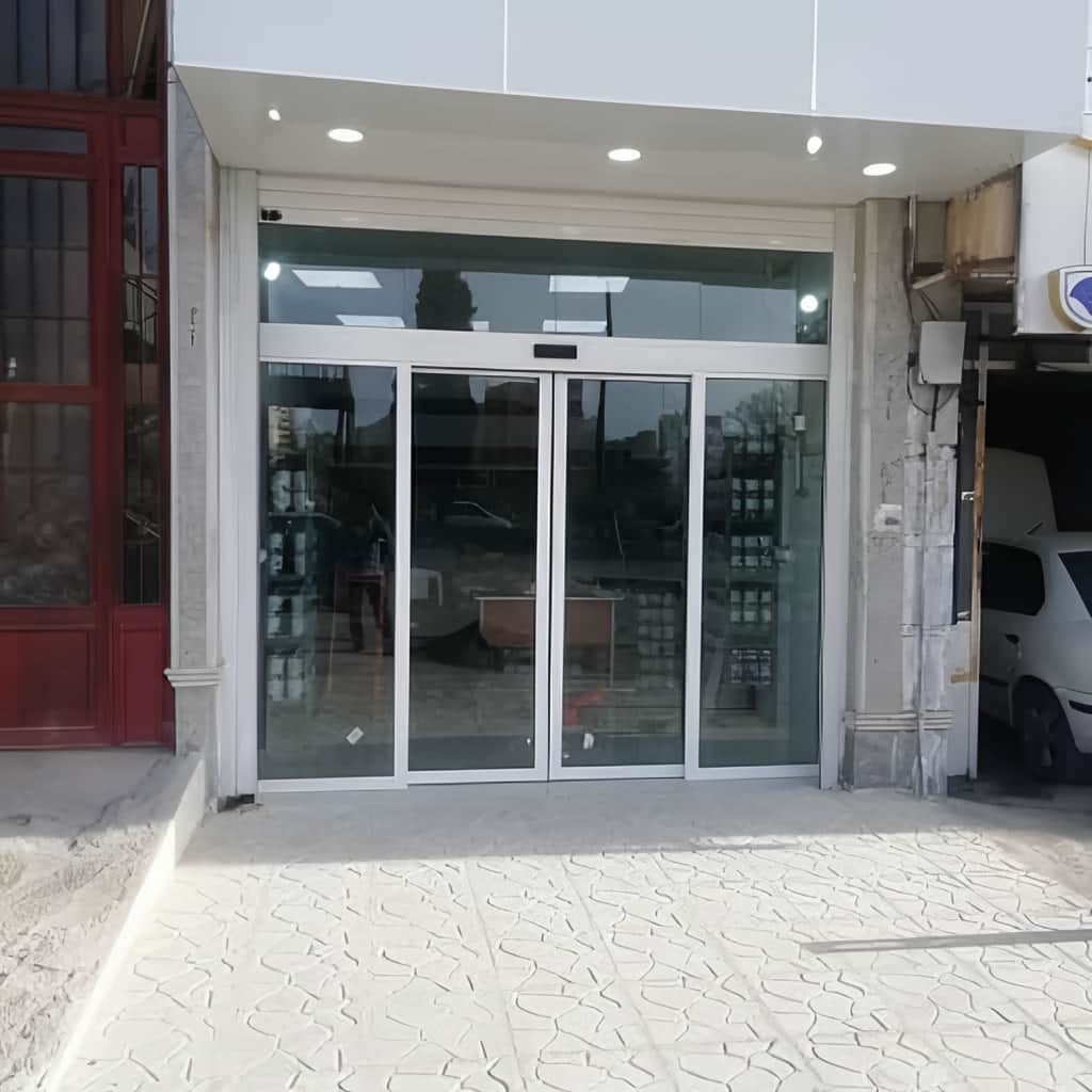 خرید درب اتوماتیک شیشه ای تک لنگه لولایی برای ورودی اداری